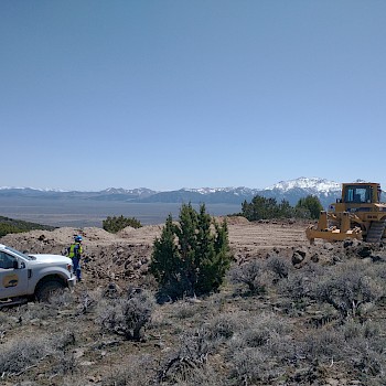 NuLegacy Drilling Supervisor Bill Mounts with Legarza Exploration road crew finishing an access road and drill platform on our Rift Anticline target.